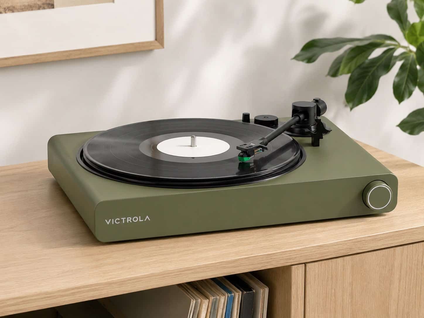 Victrola Stream Onyx turntable in matte green on wooden shelf – works with Sonos
