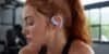 Shokz Review 2026 – woman wearing Shokz open-ear headphones during a workout